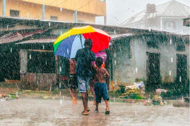 heavy rain and kids drenched image
